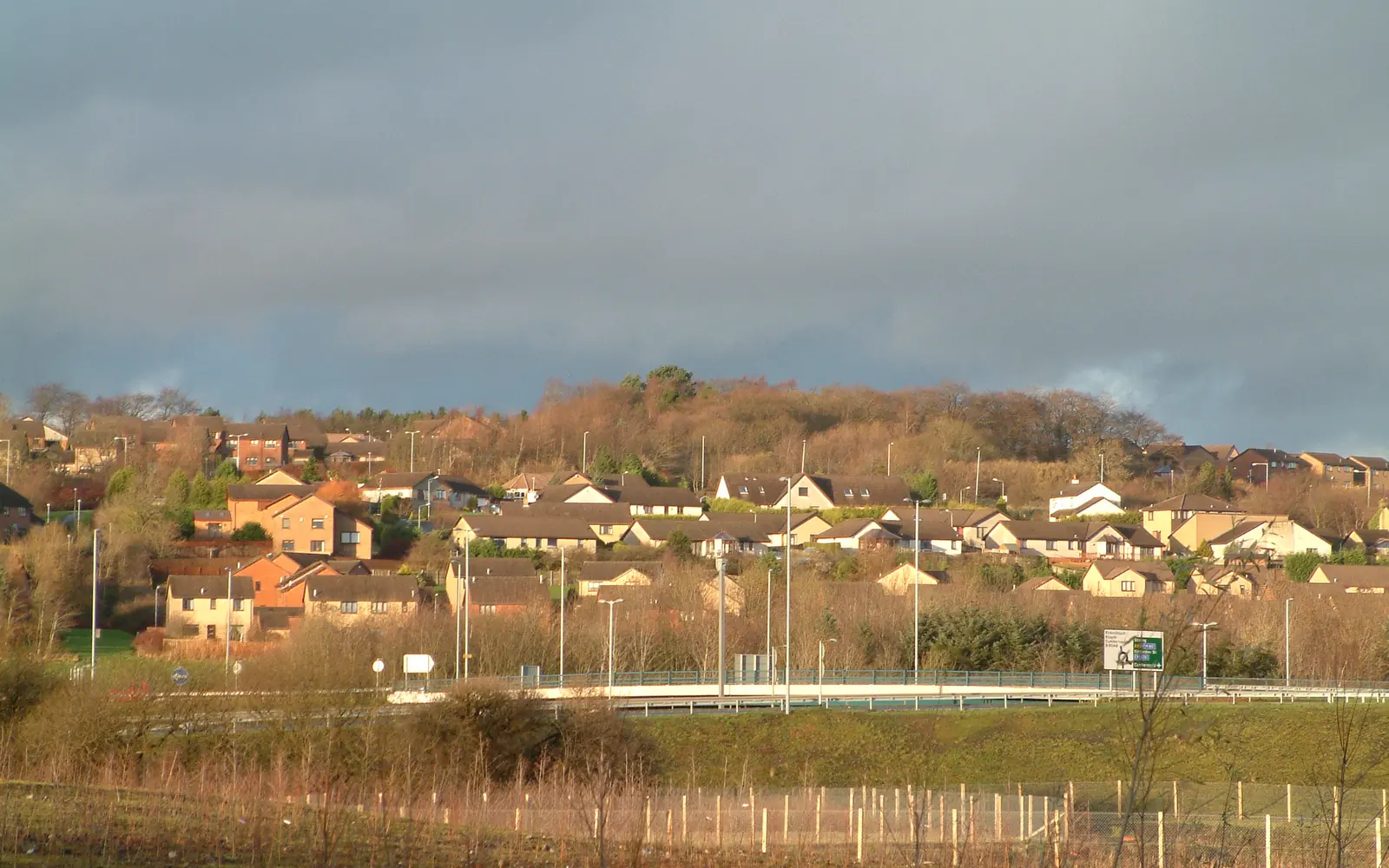 Houses on the south side of Cumbernauld with trees in autumn colour